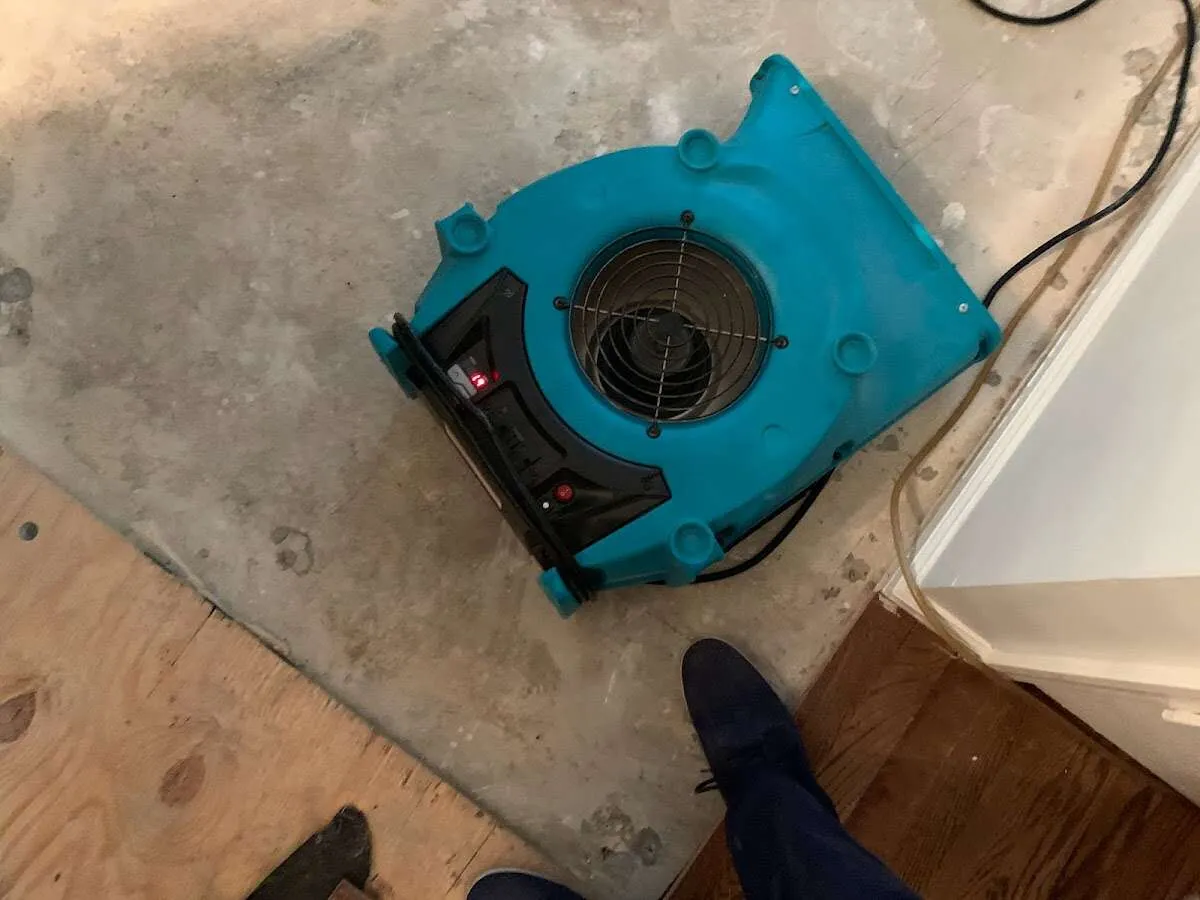Air mover drying subfloor during Leak Detection & Repair in Lodi